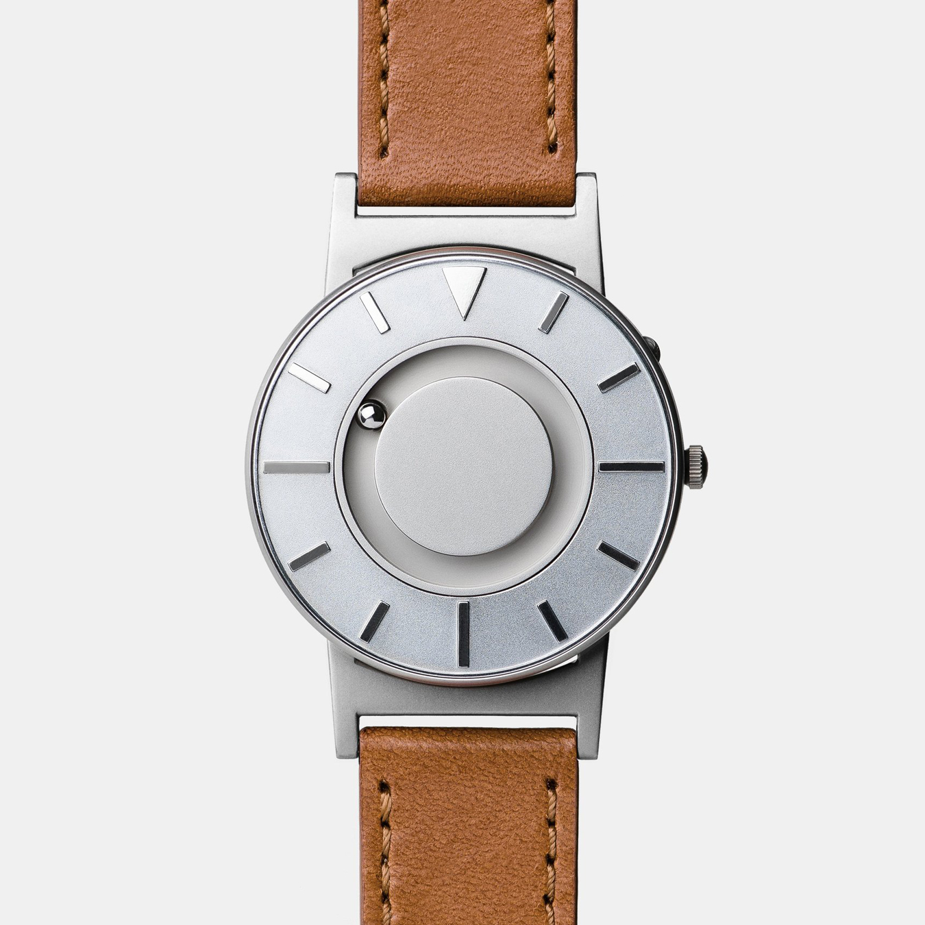 An image of the Bradley Timepiece, a watch invented for blind users. It uses magnetic ball bearings instead of hands, so when the user feels the time the movement is not able to be accidentally moved out of place.
